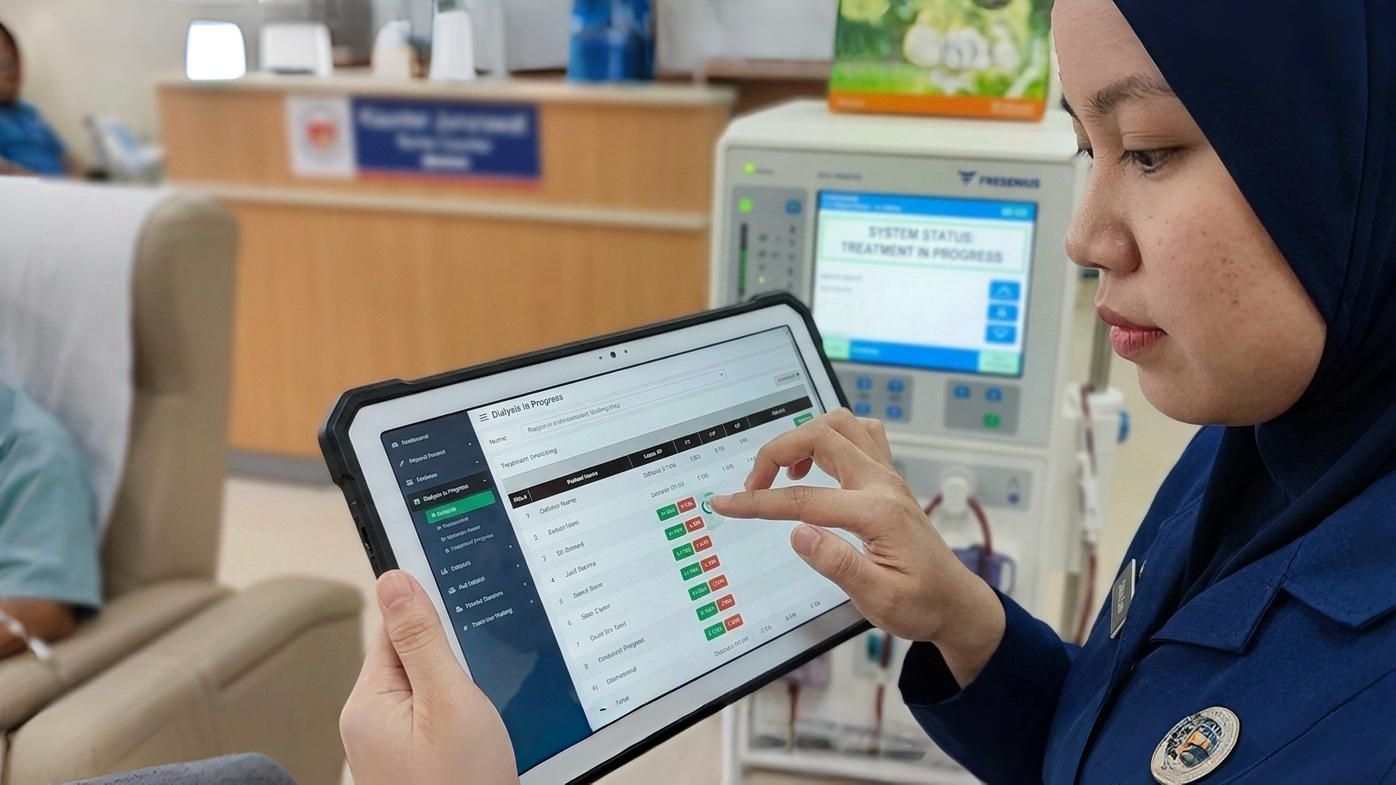 Nurse using DiMS on a tablet during dialysis treatment